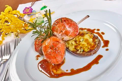 Image of lamb chops on a bed of vegetables Eggplant stuffed with vegetables Stock Photos