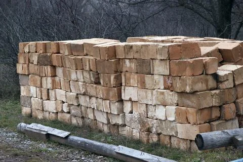 An image of a large brick stacked in a pile. Stock-Fotos