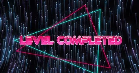 Image of level completed text over light trails on black background Stock Photos