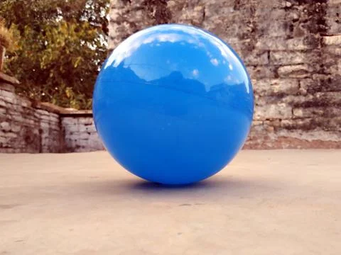 This is the image of light blue ball which is lay down on the roof Stock Photos