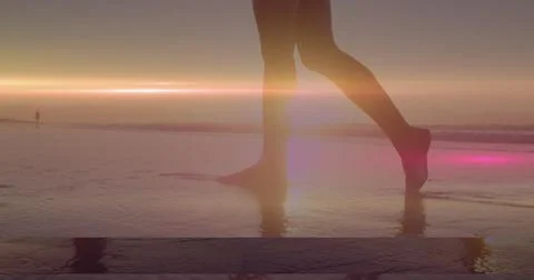 Image of light spots over caucasian woman at beach Stock Photos