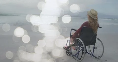 Image of light spots over disabled cuacasian woman sitting in wheelchair at Ilustração Stock