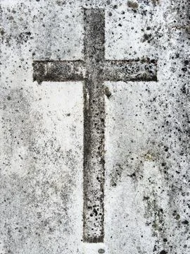 Image on light-toned stone of a vertical cross. Stock Photos