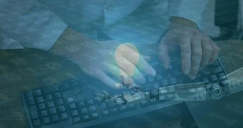 Image of lightbulb over robot's arm, binary coding and man typing on computer Stock Photos