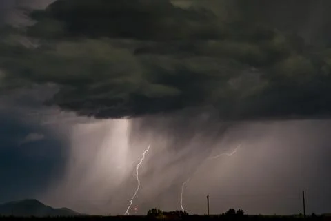 Image of lightning striking the ground Stock Photos