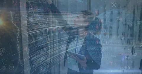 Image of lines, globe and binary code over caucasian woman checking servers Stock Photos