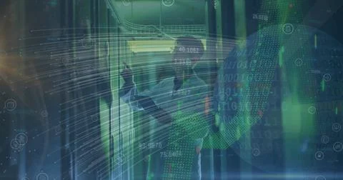 Image of lines, graphs and globe over caucasian man checking servers Foto stock