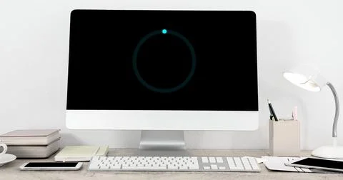 Image of loading circle on computer in office 库存插图
