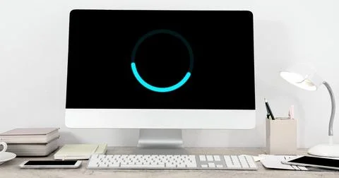 Image of loading circle on computer in office 库存插图