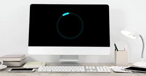 Image of loading circle on computer in office 库存插图