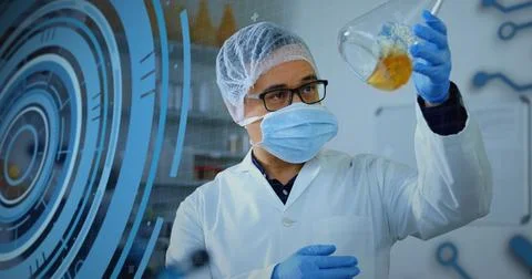 Image of loading circles, computer language, caucasian scientist wearing mask Stock Photos