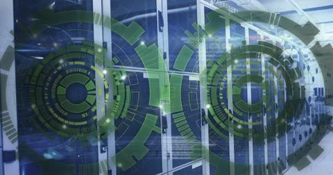 Image of loading circles over computer language against server room in back.. 写真素材