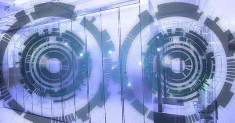 Image of loading circles over lens flares against server room in background 库存照片