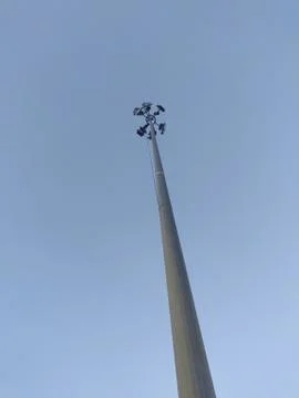 An image of a long lamp post with clear sky on the background. Copy space for Stock Photos