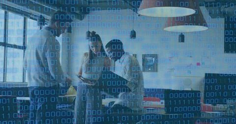 Image of looping binary codes over diverse coworkers discussing reports in Stock Photos