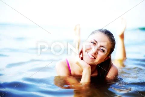 Image of luxurious woman having rest in water at summer Stock Photos