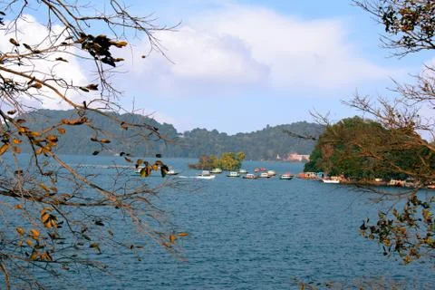 Image of maithon dam with beautiful clouds and blue water with boats Stock Photos
