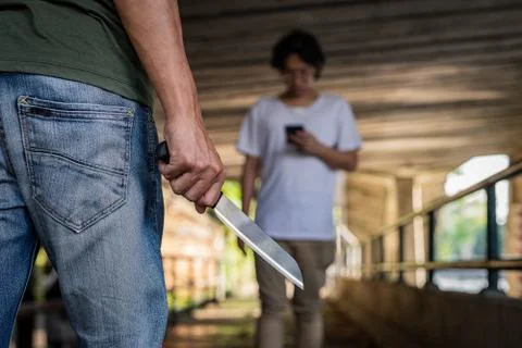 The image of a man being attacked by a knife using his knife. Stock Photos