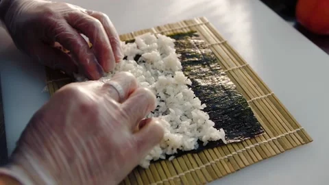 An image of man making california roll close-up Stock Footage 149980058