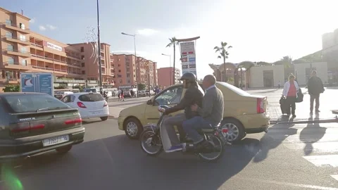 Image of man riding an old motorcycle at Marrakesh, Morocco. Stock Footage 149000260