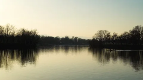 Image of man rowing alone at an artificial lake during sunset, Zagreb, Croatia. Stock Footage 105503422