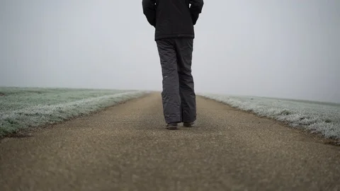 Image of man running on countryside road taken by mist, Heuchlingen, Germany. Stock Footage 102647448