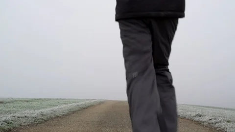 Image of man running on countryside road taken by mist, Heuchlingen, Germany. Stock Footage 102647748