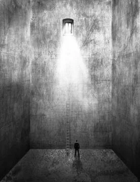 Image of a man standing in an empty room with tall walls and a ladder leading up Stock Photos