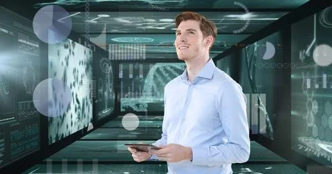Image of man using tablet, with DNA, cells and medical data on screens 写真素材