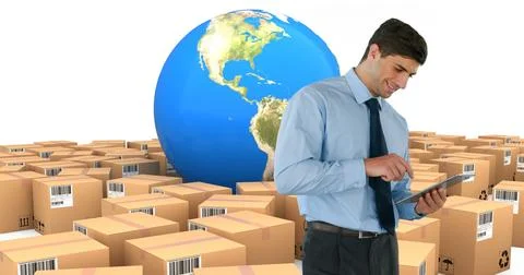 Image of man using tablet with stacks of boxes and globe on white background Foto stock