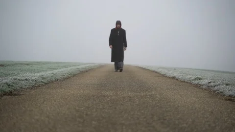 Image of man walking on countryside road taken by mist, Heuchlingen, Germany. Stock-Footage 102647499