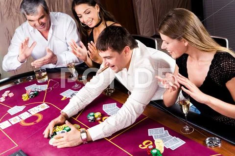 Image of man winning in gamble and people applauding to him Stock Photos