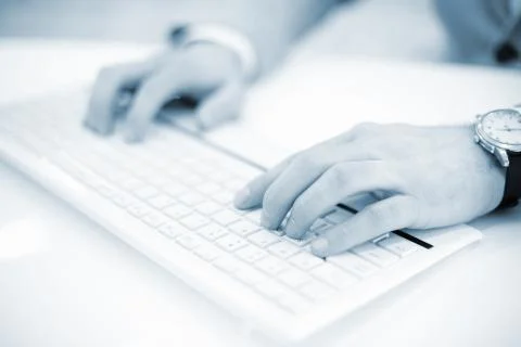 Image of man's hands typing. Selective focus. Stock Photos