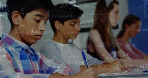 Image of math formulas moving over class of diverse pupils learning at school Stock Photos