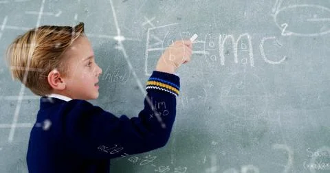 Image of math formulas over caucasian boy writing on blackboard Stock Photos