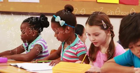 Image of math formulas over class of diverse children learning at school 写真素材