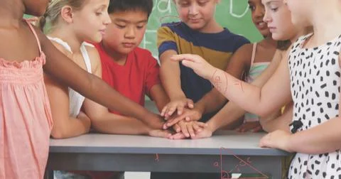 Image of math formulas over diverse pupils at school Stock Photos
