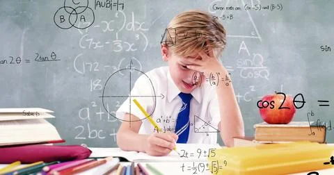 Image of math formulas over focused caucasian boy doing homework Stock Photos