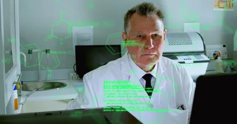 Image of medical data processing against caucasian male scientist working at Foto stock