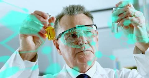 Image of medical data processing on caucasian male scientist performing Stock Photos