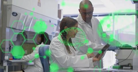 Image of medical data processing on diverse male and female scientists 스톡 사진