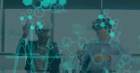 Image of medical data processing on interface, over man and woman wearing vr Stock Photos