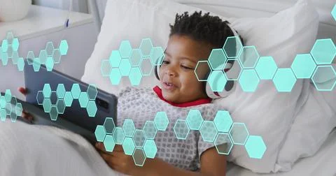 Image of medical data processing over biracial boy patient in bed 스톡 사진