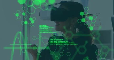 Image of medical data processing over businesswoman wearing vr headset Foto stock