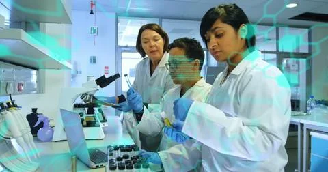 Image of medical data processing over group of diverse scientists working at Foto stock