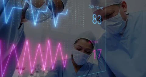 Image of medical data processing over team of diverse surgeons performing Foto stock