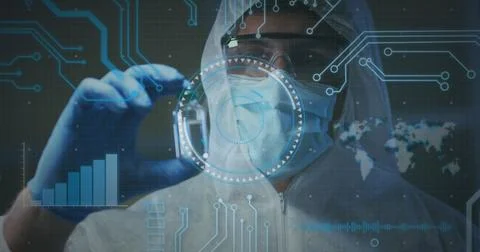 Image of medical data processing over caucasian man in face mask and ppe suit Stock Photos