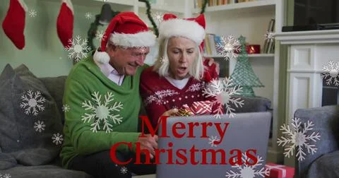 Image of merry christmas text over senior couple Ilustração Stock