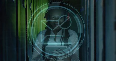Image of message block icon over african american female engineer using tab.. Foto stock