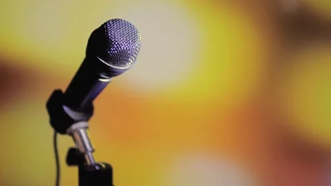 Image of a microphone on a colored background. Stock Footage 130999826